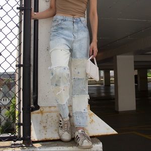 hand bleached and reworked denim jeans